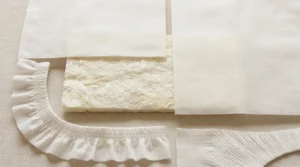 Disposable diaper materials and soft skin-contact layer